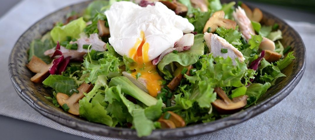 Salad with poached egg, smoked trout and marinated mushrooms