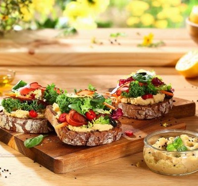 Toast with hummus, parma ham and salad