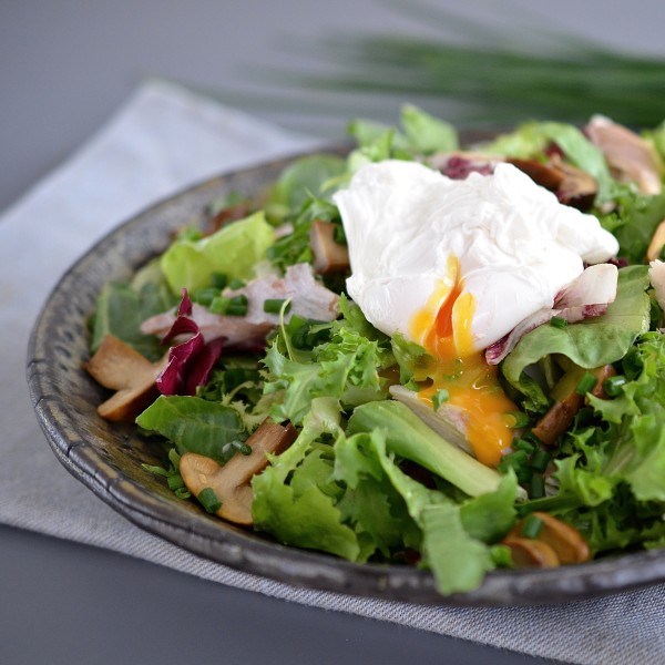 Salad with poached egg, smoked trout and marinated mushrooms