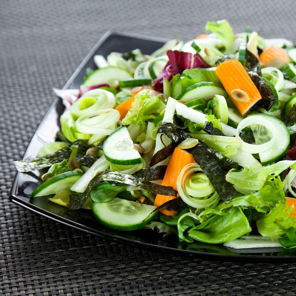 Salad with surimi, nori, cucumber and pumpkin seeds