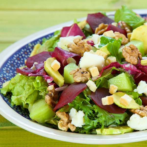 Salad with avocado, melon and young cooked beetroots